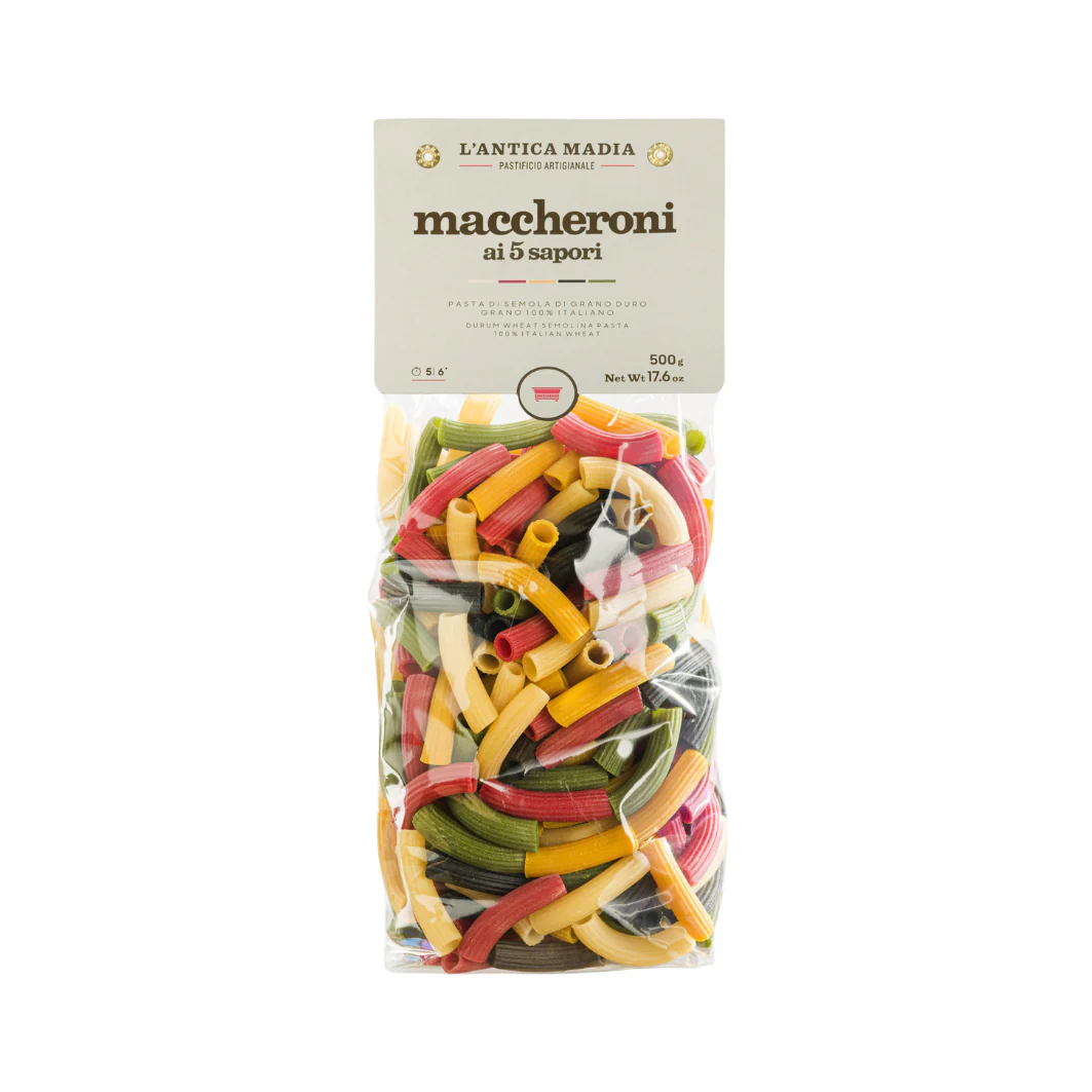 Colorful multicolored rigatoni-style pasta in sealed clear bag with label