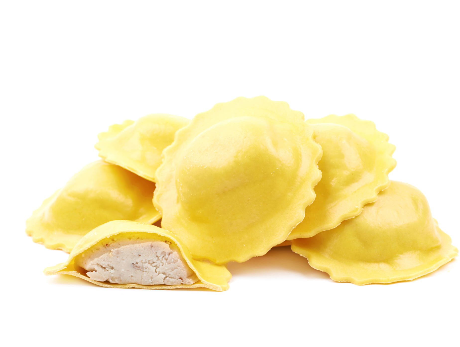 Cheese ravioli, folded yellow pasta with cut showing creamy filling